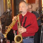 Dave Birkin handling two saxophones
